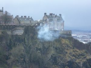 Photograph of Edinburgh Castle showing the smoke after the One O'Clock Gun was fired