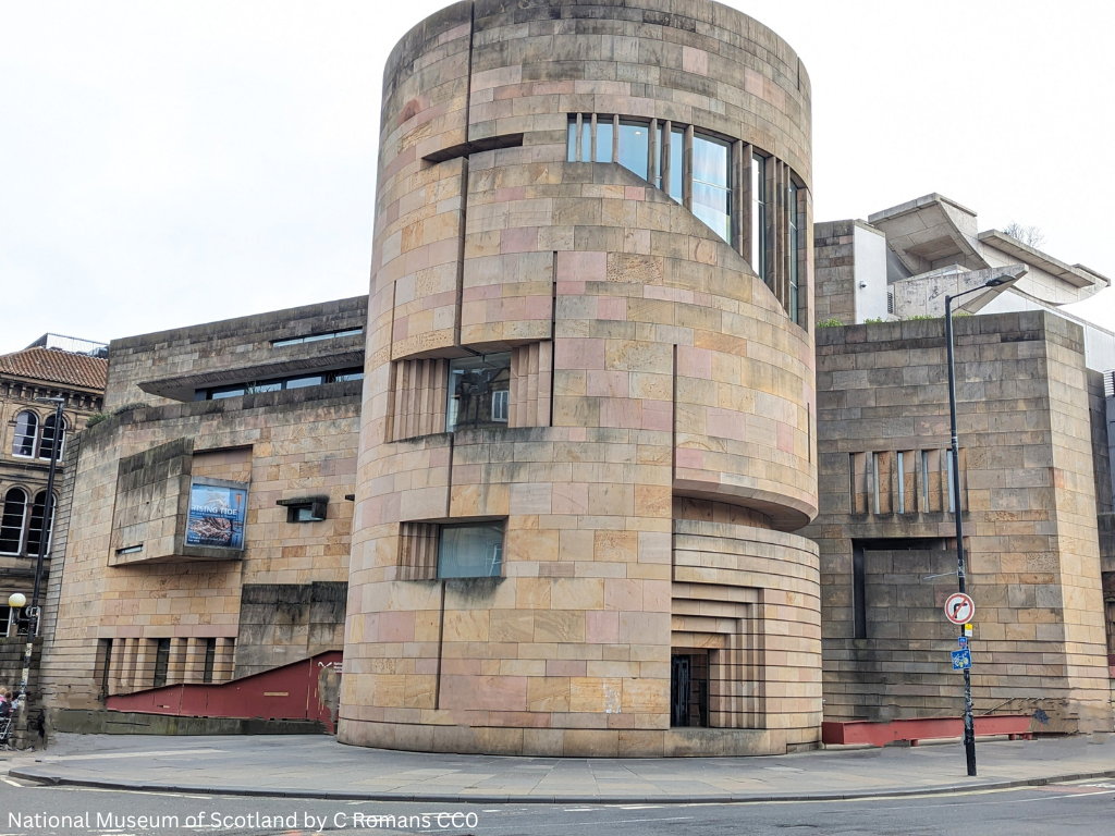 National Museum of Scotland, light sandstone with a curved tower and modern architectural features. 