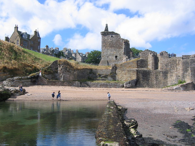 Looking toward the stone castle, clear tidal pool is in the foreground. 